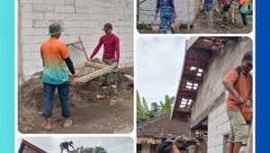 Anggota Satgas TMMD Ke-127 bersama warga memasang genting rumah RTLH milik Ibu Saidah di Desa Wonosari Pasuruan.
