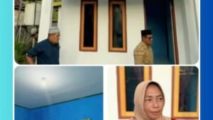 Ibu Iramaya Umagapi berdiri di depan rumah layak huni barunya di Desa Aer Salobar, Kepulauan Sula, dengan ekspresi wajah yang penuh syukur