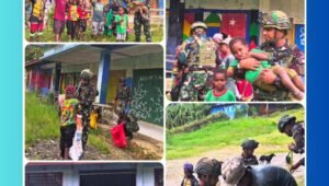 Personel Satgas Yonif 521/DY bersama masyarakat Distrik Eragayam melakukan kegiatan membersihkan lingkungan dalam acara Karya Bhakti TNI di Papua Pegunungan