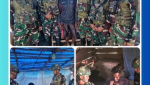 Personel Satgas Yonif 521/DY bersama Komandan Letkol Inf Rahadyan Surya Murdata, S.E, M.I.P, saat membagikan kaos kepada warga Distrik Eragayam, Kabupaten Mamberamo Tengah, Papua Pegunungan dalam kegiatan berbagi kasih yang penuh kehangatan.
