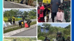 Para personel Satgas Yonif 521/DY dan pemuda Distrik Kobakma berfoto bersama setelah menyelesaikan kegiatan karya bakti pembersihan jalan kampung di Kabupaten Mamberamo Tengah, Papua Pegunungan, 10 Maret 2026.