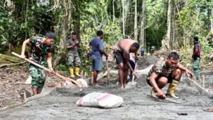 TMMD Ke-128 Kodim 1801 Manokwari Pengecoran Jalan Capai 85 Persen. - thewasesanews.com