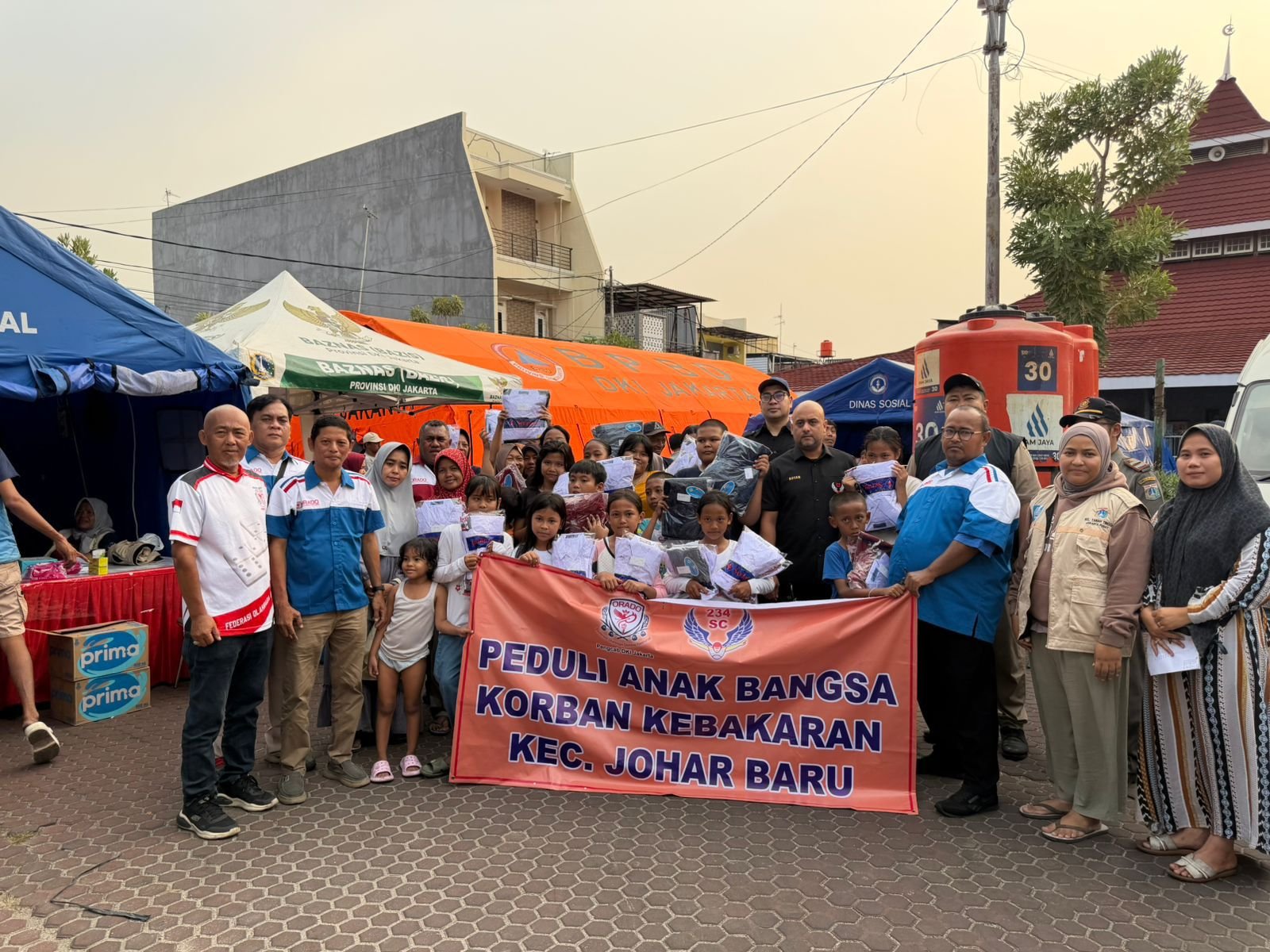 ORADO dan 234 SC Salurkan Bantuan Seragam Sekolah Korban Kebakaran Johar Baru. - thewasesanews.com