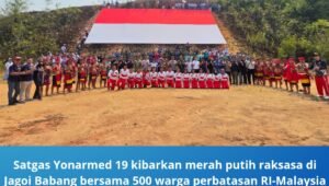 satgas yonarmed 19 kibarkan merah putih raksasa di jagoi babang. - thewasesanews.com